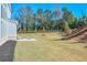 Expansive backyard featuring a patio with lounge seating and manicured landscaping at 3440 Carswell Bnd, Cumming, GA 30028