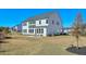 Spacious backyard featuring a modern home with large windows and a patio area for outdoor enjoyment at 3440 Carswell Bnd, Cumming, GA 30028