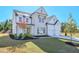 Beautiful two-story home with a two-car garage and a well-maintained front lawn with landscaping at 3440 Carswell Bnd, Cumming, GA 30028