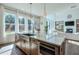 Open-concept kitchen boasts a stainless steel island sink with views into the living room with fireplace at 3440 Carswell Bnd, Cumming, GA 30028