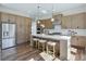 Beautiful kitchen features a spacious center island with seating and stainless steel appliances at 3440 Carswell Bnd, Cumming, GA 30028