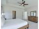 A main bedroom featuring a ceiling fan, recessed lighting, carpeted floors, and a wood dresser for ample storage at 3440 Carswell Bnd, Cumming, GA 30028