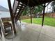 Backyard with a playground set, green grass, wooden fence, and concrete patio at 1015 Crest Ridge Sw Pl, Marietta, GA 30060