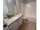 Bathroom featuring a granite countertop, updated fixtures, and shower over tub at 1015 Crest Ridge Sw Pl, Marietta, GA 30060