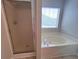 Cozy bathroom featuring a tub and separate shower, offering relaxation and convenience at 1015 Crest Ridge Sw Pl, Marietta, GA 30060