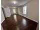 Bright bedroom featuring hardwood floors and two large windows at 1015 Crest Ridge Sw Pl, Marietta, GA 30060