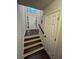Inviting foyer showcasing hardwood floors, stairs, a high ceiling and natural light at 1015 Crest Ridge Sw Pl, Marietta, GA 30060