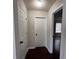 Hallway showcasing hardwood floors, and access to the bedroom, offers a sense of arrival at 1015 Crest Ridge Sw Pl, Marietta, GA 30060