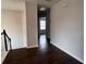Hallway with hardwood floors connecting various rooms in the house at 1015 Crest Ridge Sw Pl, Marietta, GA 30060