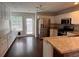 Kitchen with white cabinets, stainless steel appliances and granite countertops at 1015 Crest Ridge Sw Pl, Marietta, GA 30060