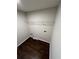 This laundry room features hardwood floors, wire shelf and utility connections at 1015 Crest Ridge Sw Pl, Marietta, GA 30060