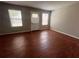 Room features hardwood floors, a door, and a window that bring in natural light at 1015 Crest Ridge Sw Pl, Marietta, GA 30060