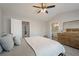Spacious bedroom with a large bed, dresser, and convenient access to the bathroom at 1240 Kilmington Ct, Alpharetta, GA 30009