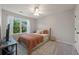 Cozy bedroom features natural light, neutral tones, and plush carpeting at 1240 Kilmington Ct, Alpharetta, GA 30009