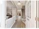 Inviting entryway with light gray walls, wood-look flooring, staircase, and natural light at 1240 Kilmington Ct, Alpharetta, GA 30009