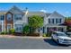 Inviting townhome with well-maintained landscaping, charming shutters, and convenient parking at 1240 Kilmington Ct, Alpharetta, GA 30009