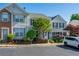 Inviting townhome with well-maintained landscaping, charming shutters, and convenient parking at 1240 Kilmington Ct, Alpharetta, GA 30009