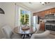 Inviting eat-in kitchen featuring stainless steel appliances, wooden cabinets, and abundant natural light at 1240 Kilmington Ct, Alpharetta, GA 30009