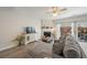 Cozy living room featuring a corner fireplace, modern furnishings, and sliding glass doors to the outside at 1240 Kilmington Ct, Alpharetta, GA 30009