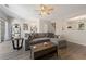 Living room with sliding glass door to the outside, comfortable couch, and an adjacent staircase at 1240 Kilmington Ct, Alpharetta, GA 30009