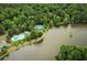 Aerial view of community amenities, including a pool, tennis courts and lake access at 2075 Six Branches, Roswell, GA 30076