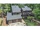Aerial view of the home with mature landscaping and a large lot at 2075 Six Branches, Roswell, GA 30076