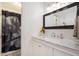 Bathroom featuring a marble countertop vanity and a decorative floral shower curtain at 2075 Six Branches, Roswell, GA 30076
