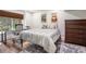Comfortable bedroom with window and view of greenery, laminate flooring, and wood dresser at 2075 Six Branches, Roswell, GA 30076