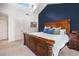 Comfortable bedroom featuring a large window, an accent wall, and a charming wooden dresser at 2075 Six Branches, Roswell, GA 30076