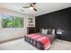 Bedroom features a statement wall, natural light, and neutral color palette at 2075 Six Branches, Roswell, GA 30076