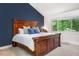 Comfortable bedroom featuring a large window, an accent wall, and plenty of natural light at 2075 Six Branches, Roswell, GA 30076