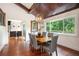 Inviting dining area with hardwood floors, wood ceiling, and large windows providing scenic views at 2075 Six Branches, Roswell, GA 30076