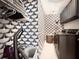 Functional laundry room with ample storage and a stylish black and white wallpaper design at 2075 Six Branches, Roswell, GA 30076