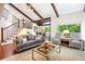 Open concept living room with vaulted ceilings, a staircase, and a seamless flow to the dining area at 2075 Six Branches, Roswell, GA 30076