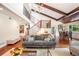 Open-concept living room featuring high ceilings, exposed beams, and a dining area with scenic views at 2075 Six Branches, Roswell, GA 30076