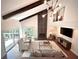 Bright living room features a vaulted ceiling, fireplace, and an open floor plan at 2075 Six Branches, Roswell, GA 30076