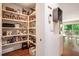 Walk-in pantry with ample shelving for organized storage at 2075 Six Branches, Roswell, GA 30076