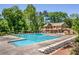 Bright and spacious pool area with lounge chairs, perfect for soaking up the sun and enjoying outdoor recreation at 2075 Six Branches, Roswell, GA 30076