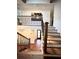 Beautiful staircase with dark hardwood treads and balusters, contrasted with white risers at 2075 Six Branches, Roswell, GA 30076