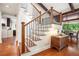 Staircase featuring modern railings and hardwood steps at 2075 Six Branches, Roswell, GA 30076