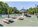 Serene tennis court area with picnic tables, creating a relaxed atmosphere for enjoying sports and outdoor gatherings at 2075 Six Branches, Roswell, GA 30076