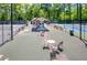 Outdoor tennis courts with a central seating area, ideal for socializing and enjoying matches with friends at 2075 Six Branches, Roswell, GA 30076