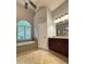 Bathroom featuring shower, soaking tub, tile flooring, and vanity with drawers at 3400 Suwanee Creek Rd, Suwanee, GA 30024