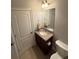 Cozy bathroom featuring a single vanity with granite top, tiled floors, and a toilet at 3400 Suwanee Creek Rd, Suwanee, GA 30024