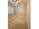 Clean bedroom with carpet flooring, a bright window, and a ceiling fan at 3400 Suwanee Creek Rd, Suwanee, GA 30024