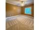 Empty bedroom with tan carpet and a window at 3400 Suwanee Creek Rd, Suwanee, GA 30024