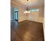 Formal dining room with hardwood floors, chandelier, and ample lighting at 3400 Suwanee Creek Rd, Suwanee, GA 30024
