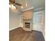 Cozy fireplace with stone surround and built-in shelving at 3400 Suwanee Creek Rd, Suwanee, GA 30024