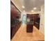 Spacious kitchen features dark wood cabinets, granite countertops, and stainless steel appliances at 3400 Suwanee Creek Rd, Suwanee, GA 30024