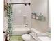 Stylish bathroom featuring white marble tiles, a bathtub, and decorative accents at 40 Luther Knight Se Rd, Cartersville, GA 30121